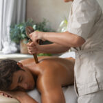 a man receiving a thai massage from a therapist
