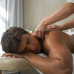 a man laying down having a sport massage